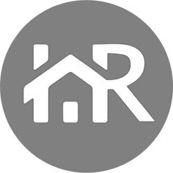 a white house in a grey circle